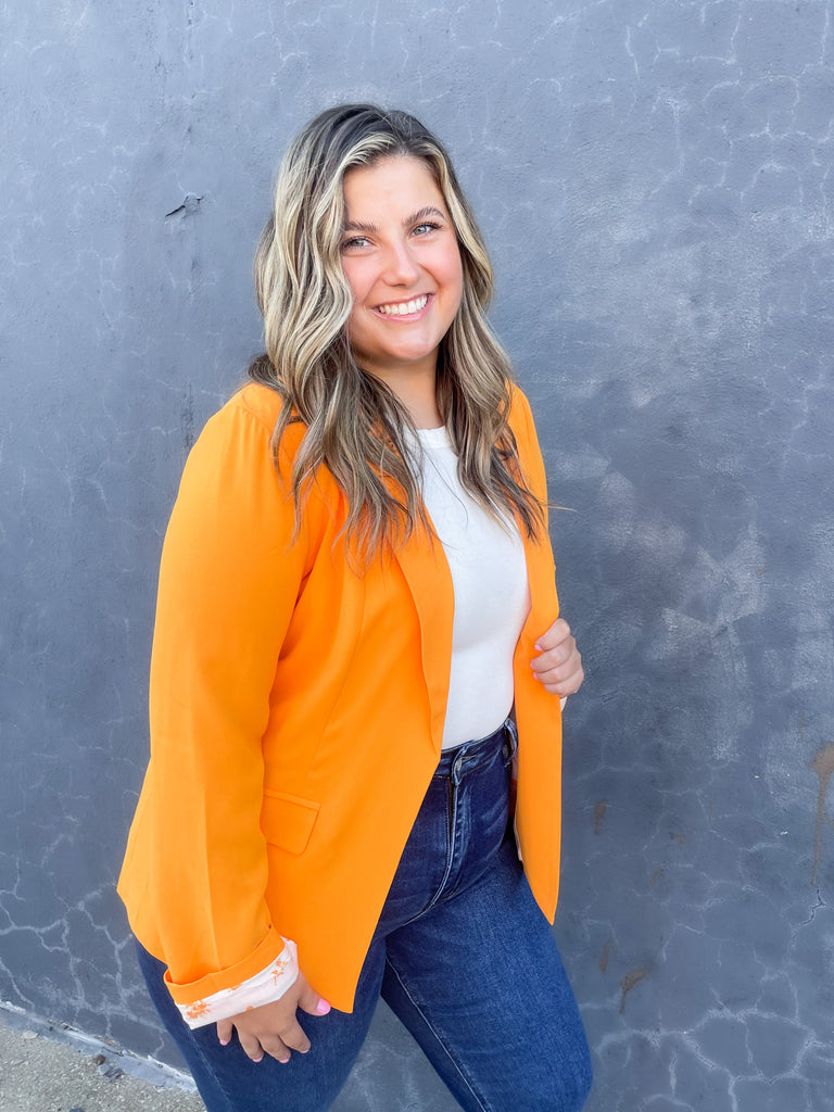 skies are blue long sleeve welt pocket blazer with silky floral or stripe printed lining. Available in hyper pink, Kelly green, or sun kissed orange.