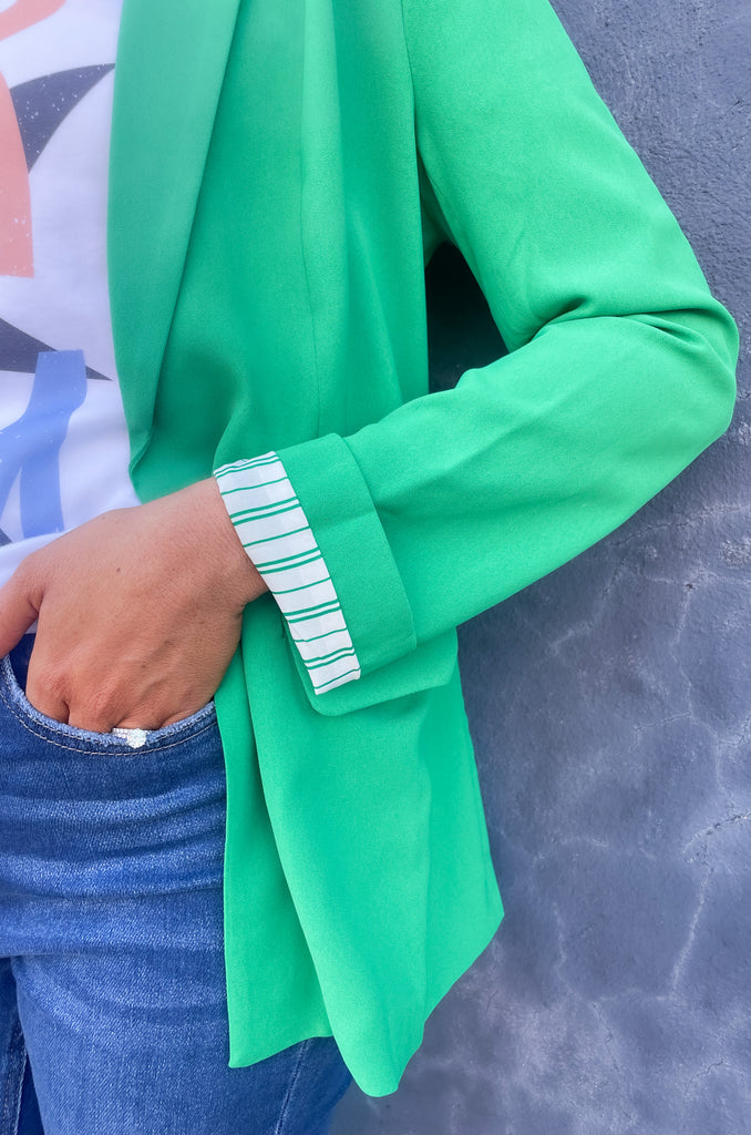 skies are blue long sleeve welt pocket blazer with silky floral or stripe printed lining. Available in hyper pink, Kelly green, or sun kissed orange.