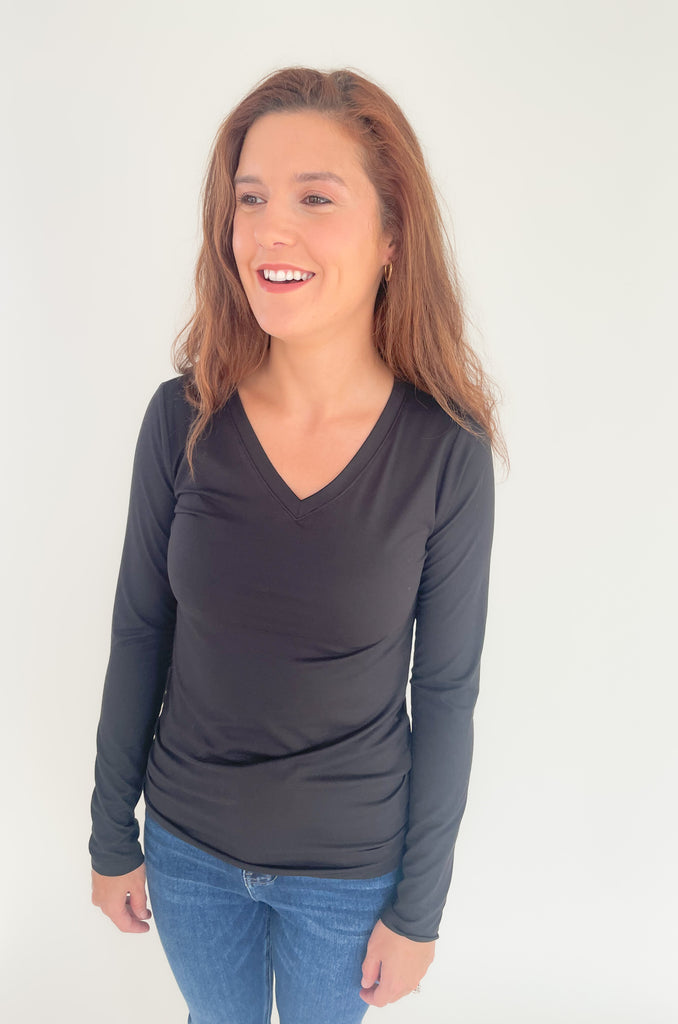 The Black Brushed Microfiber Long Sleeve V Neck is an amazing basic! It's semi-fitted with a soft and stretch material. 