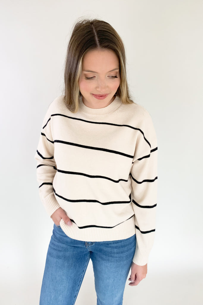 The Horizontal Stripe Beige & Black Sweater is a stunner! We love anything classic and the black and beige stripes are perfect. Not only is this sweater super chic, the fabric is buttery soft. It will keep you cozy and stylish all season. 