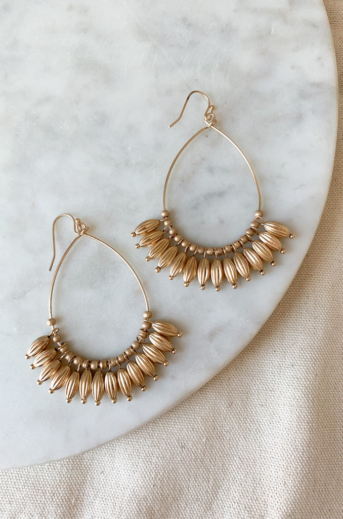 Make a statement with these stylish Teardrop Earrings with Beaded Dangles. Handcrafted, these elegant earrings are the perfect addition to any wardrobe. Their sophisticated design provides timeless style and a touch of elegance that is sure to draw attention. They are lightweight and comfortable too! 