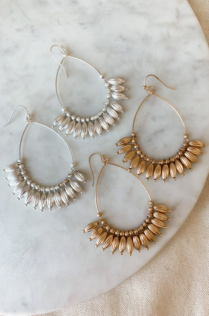 Make a statement with these stylish Teardrop Earrings with Beaded Dangles. Handcrafted, these elegant earrings are the perfect addition to any wardrobe. Their sophisticated design provides timeless style and a touch of elegance that is sure to draw attention. They are lightweight and comfortable too! 