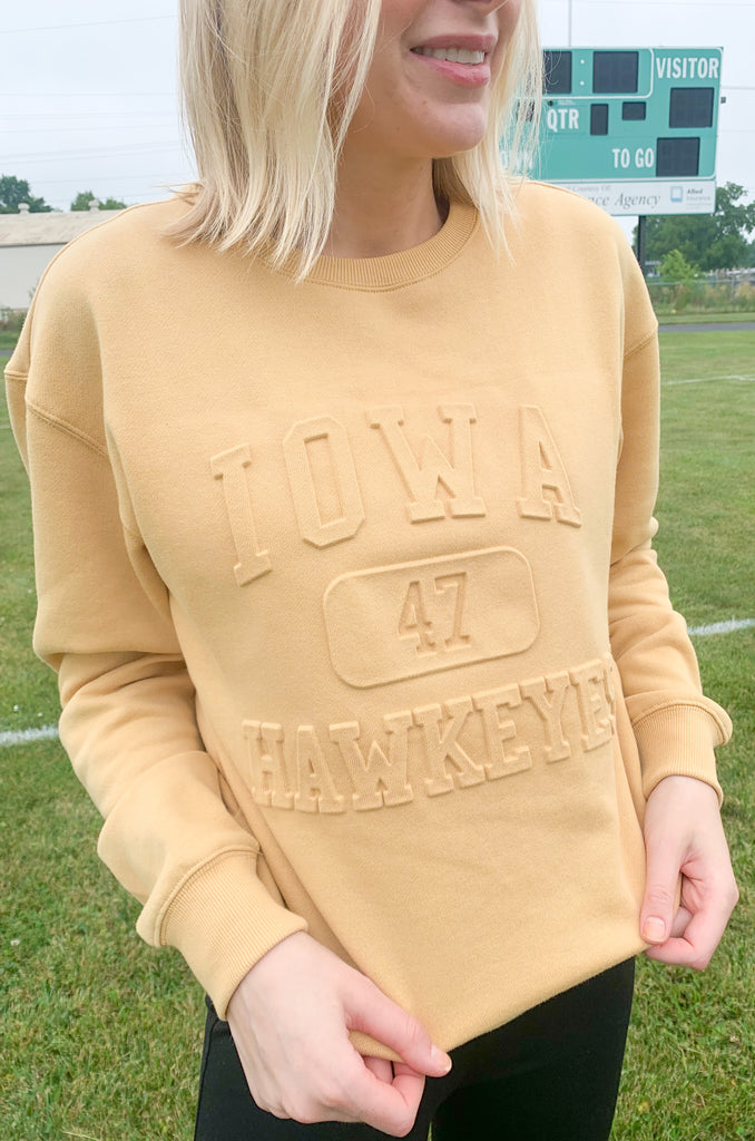 The U of I Vintage 81 Emboss Crewneck is designed with a fun, vintage-inspired look that's cute and cozy for game day! This classic crewneck features a raised embossed logo on the front that's so unique. You cannot find crewnecks like these just anywhere! Add some of our favorite Iowa accessories and you are ready for your next tailgate.