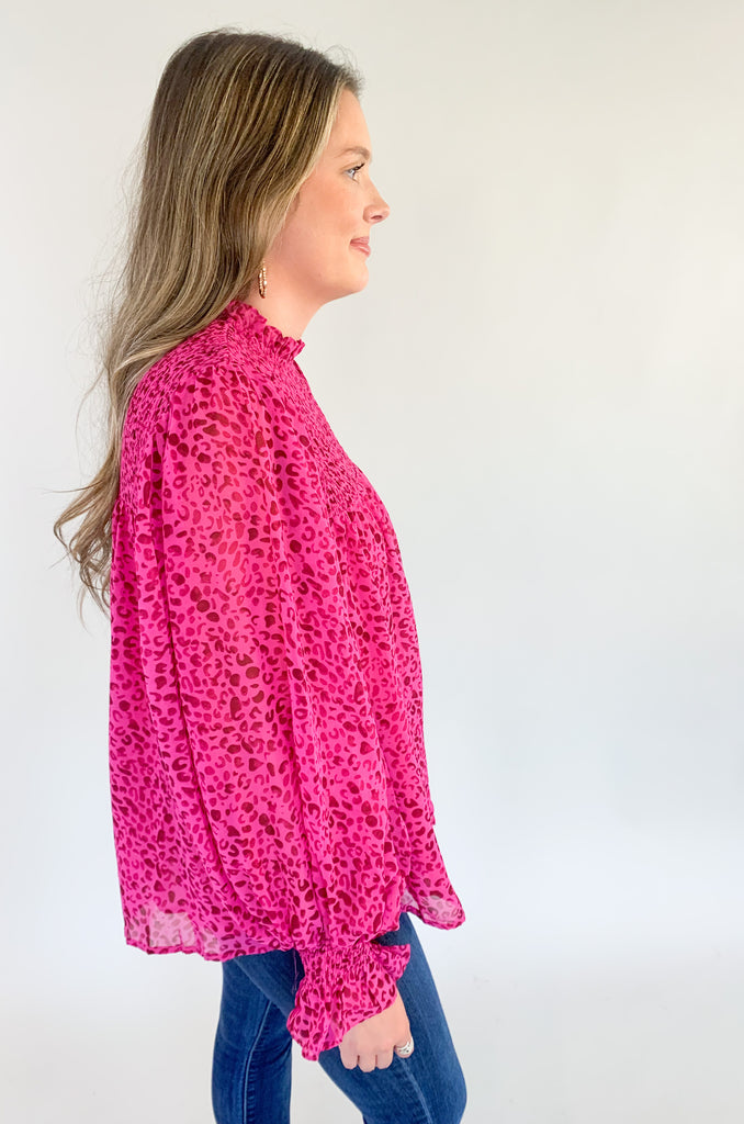 Magenta pink with leopard print blouse with ruched details, flowy body, and balloon sleeves