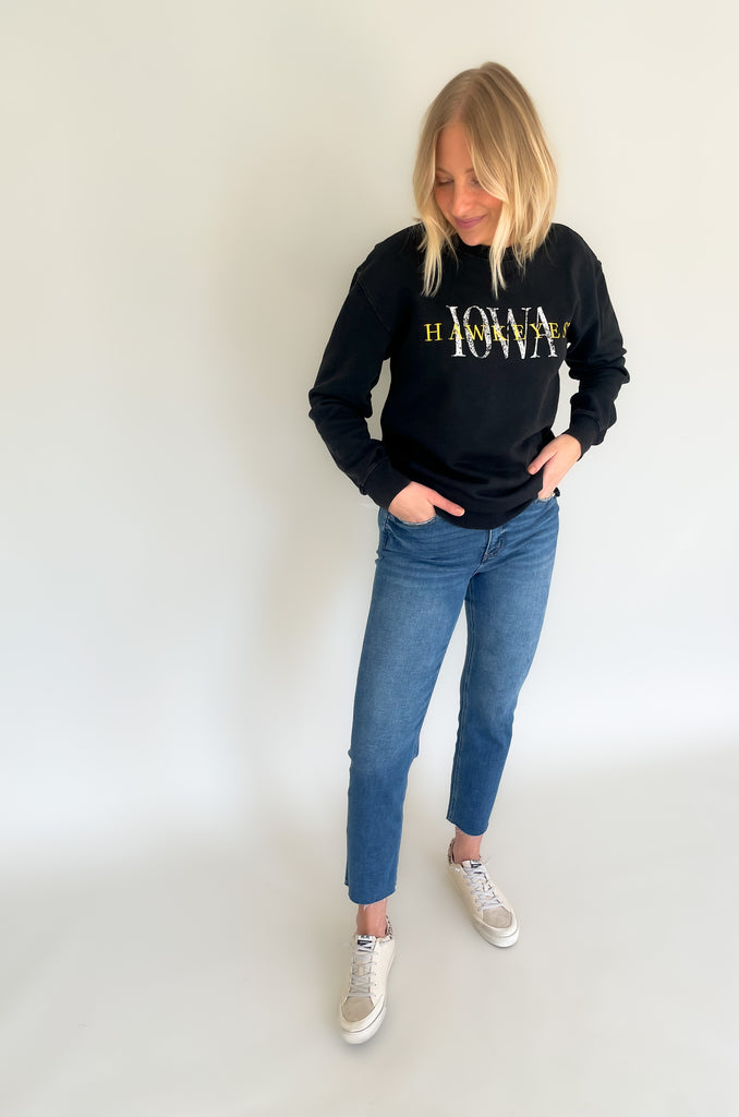 The IOWA Brooks Bock Fleece Crewneck is perfect for hawkeyes fans! Its black fleece and yellow embroidered "Hawkeyes" and printed "IOWA" create a stylish statement. Aside from being perfect for game day, it's also extremely soft and cozy. Show your school spirit with this high-quality crewneck for this fall, or gift one to your favorite Iowa Alum.