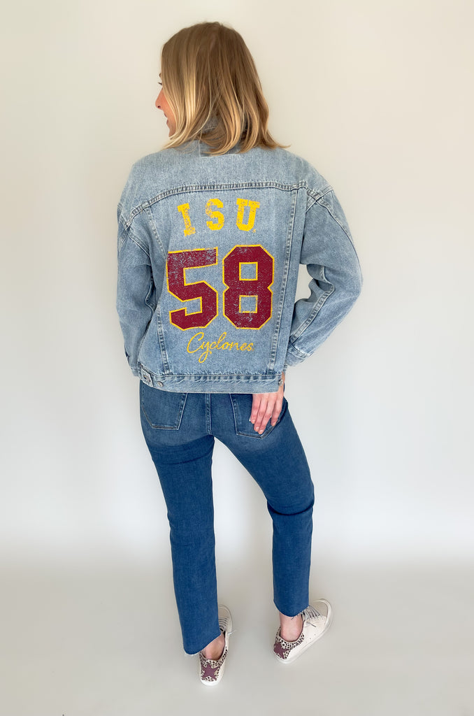 Stay warm and stylish on your next game day in this ISU Higgins Medium Wash Denim Jacket! Made from quality denim with "ISU Cyclones" printed on the back, this jacket is perfect for fans of all ages. Show off your school pride in this timeless classic for this tailgating season.