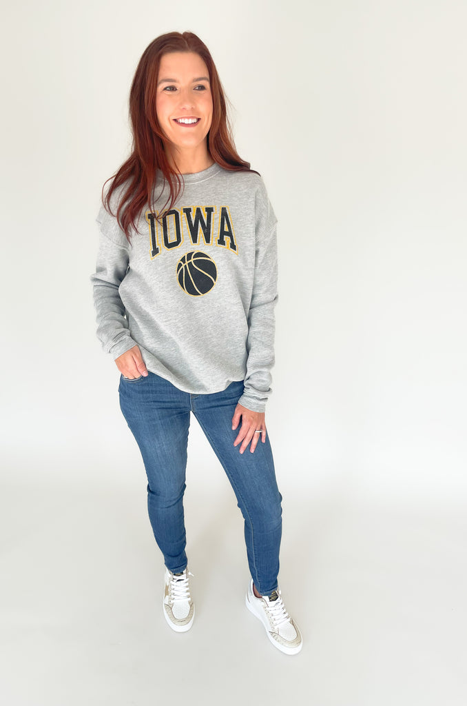 The Iowa Basketball Graphic Fleece Pullover is cute, comfortable, and a go-to option for all of our Hawkeye lovers! We love a simple pullover, especially for those busy days. This style has a block letter "IOWA" graphic with a basketball. Pair this style with denim or leggings for an effortless look!