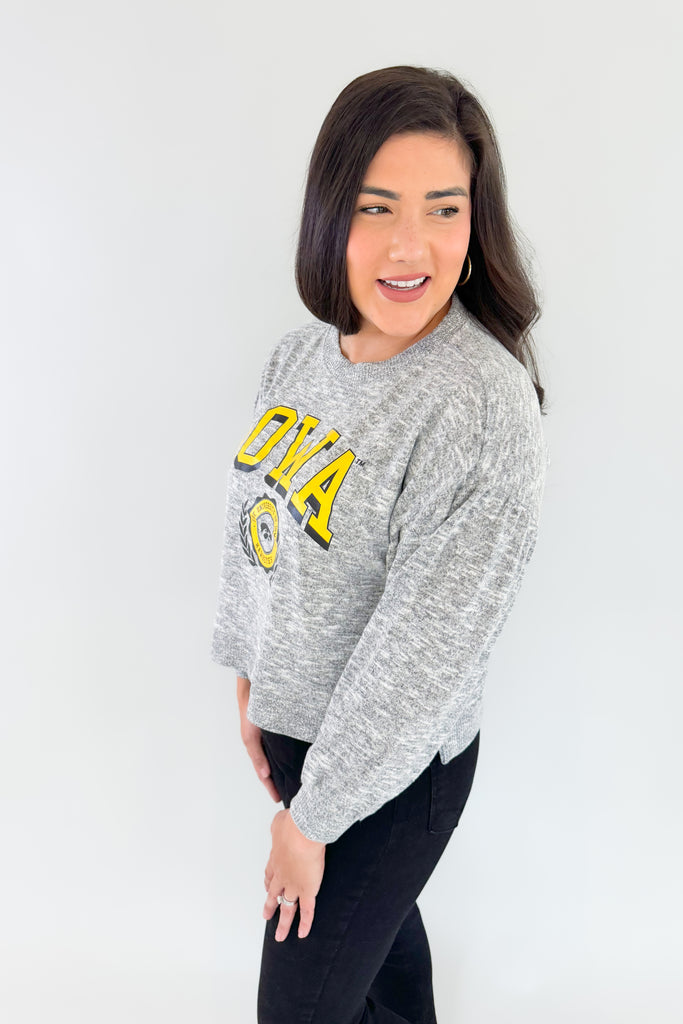 Stay cozy and game day ready with this Iowa Soft Heather pullover! Featuring puff sleeves, a heathered grey wash, and a subtle logo on the chest, this pullover is perfect for on-campus strolls or at-home lounging. Hawkeye fans, you will love the fabric because it's incredibly soft and lightweight, making it a comfortable option. We love the puff sleeve details too, giving this style a unique feminine look! 