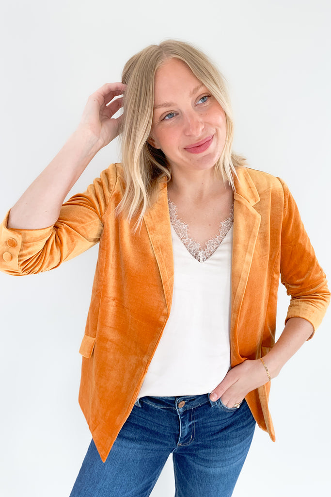 The Iris Velvet Blazer is a must-have! It is perfect for making a statement and hits the 70s trend we cannot get enough of this year. All of the details elevate this style. Although it is a fitted blazer, it is very stretchy and comfortable. 