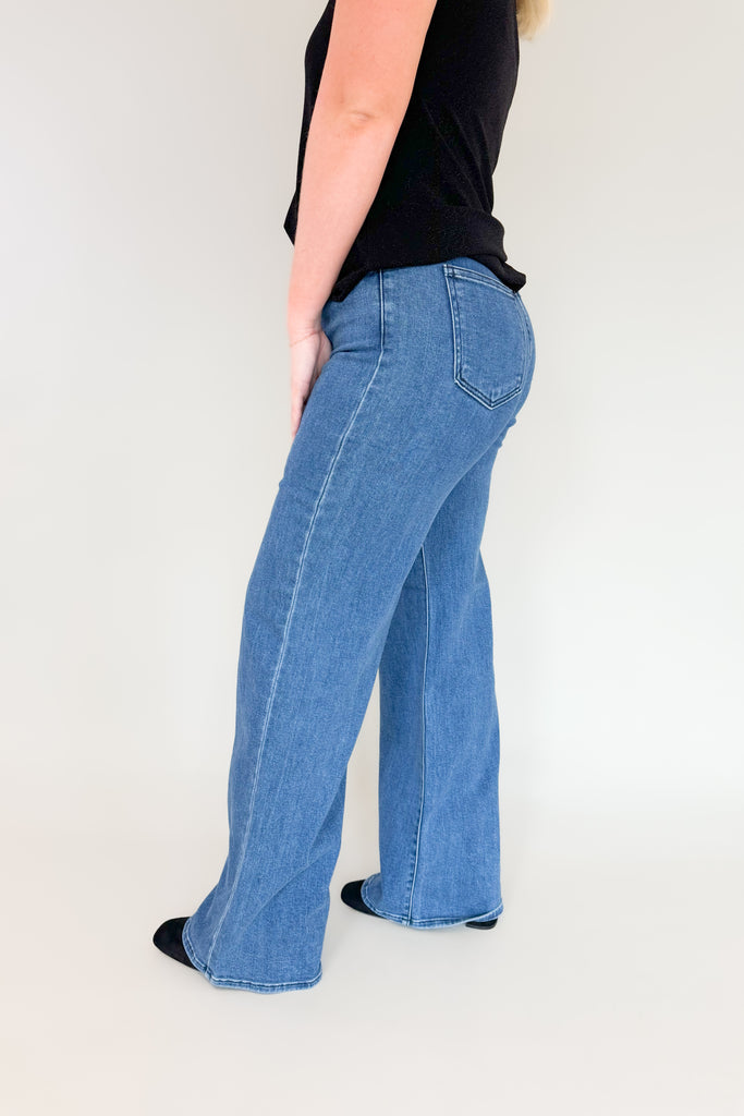 Our Jack Medium Wash Palazzo Jean is the perfect jean for any occasion! With an ultra high rise, 70s inspired wash, and a super long and stretchy fit, you'll feel confident and cozy all day. You cannot go wrong with this quality!