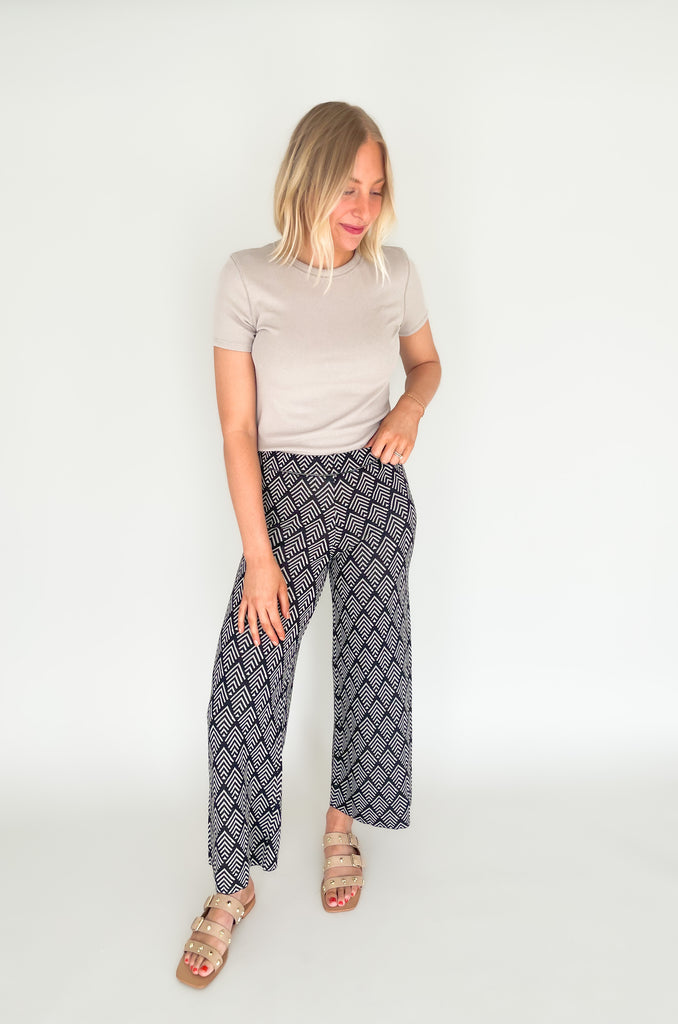 These Jacquard Wide Leg Sweater Pants are perfect for adding a stylish touch to your fall wardrobe. Featuring a fun abstract printed design and a wide leg silhouette, these pants will keep you looking and feeling chic all day long!