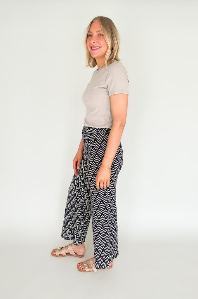 These Jacquard Wide Leg Sweater Pants are perfect for adding a stylish touch to your fall wardrobe. Featuring a fun abstract printed design and a wide leg silhouette, these pants will keep you looking and feeling chic all day long!