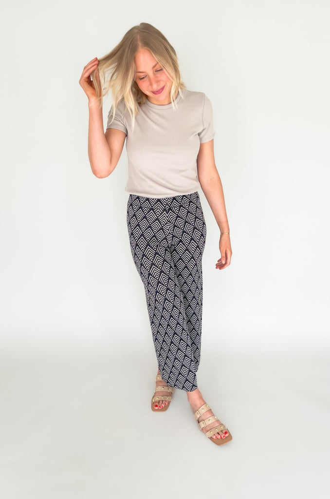 These Jacquard Wide Leg Sweater Pants are perfect for adding a stylish touch to your fall wardrobe. Featuring a fun abstract printed design and a wide leg silhouette, these pants will keep you looking and feeling chic all day long!