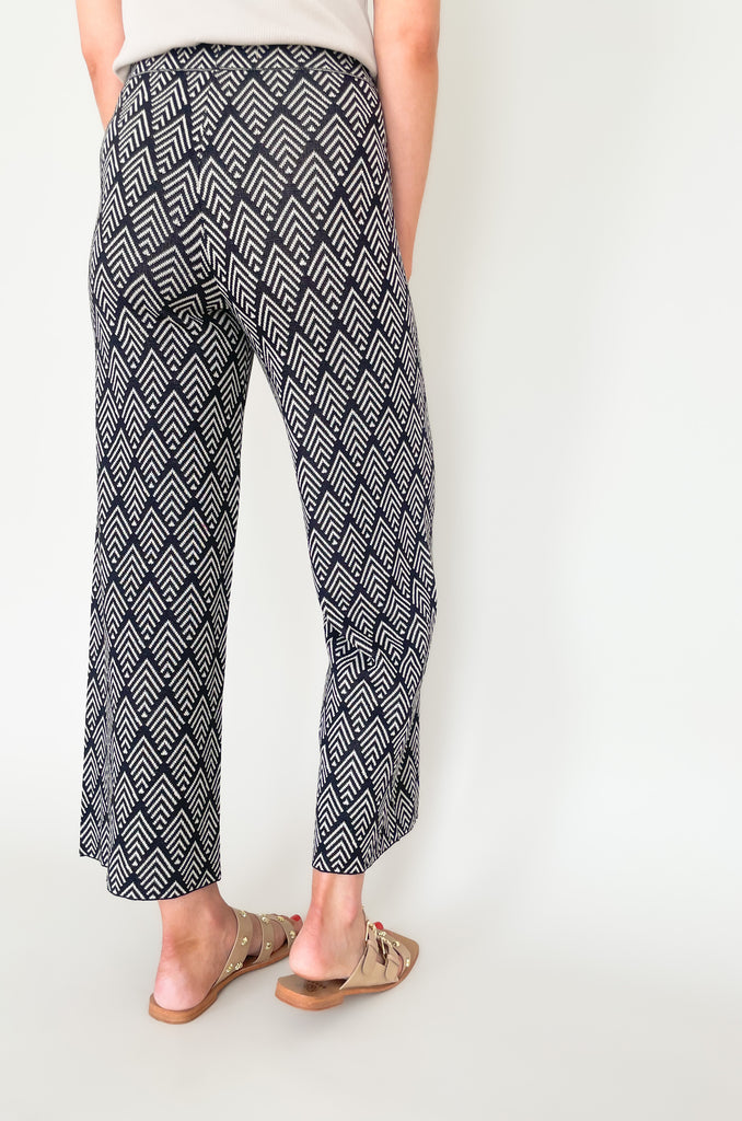 These Jacquard Wide Leg Sweater Pants are perfect for adding a stylish touch to your fall wardrobe. Featuring a fun abstract printed design and a wide leg silhouette, these pants will keep you looking and feeling chic all day long!