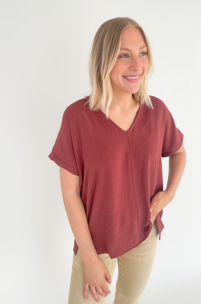 The Jamie V Neck Center Seam Blouse is a lightweight style that can be dressed up or down for any occasion! This chic v-neck top has a cuffed sleeves and a center seam design for added detail. It's a fool proof basic to always have in your closet! 