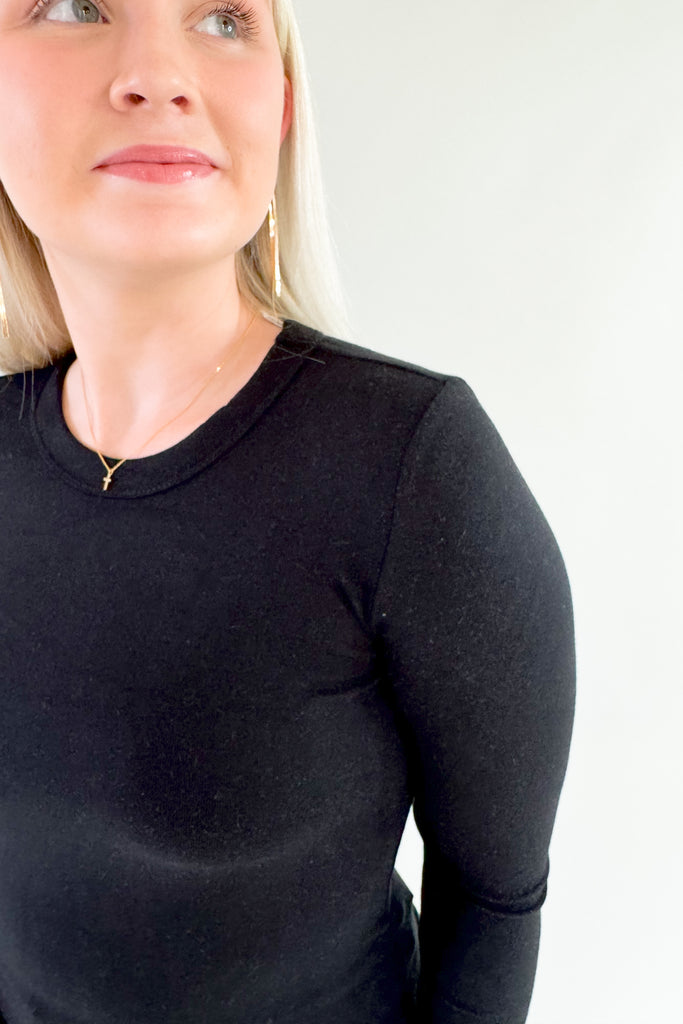 This classic Jen Round Neck Long Sleeve Knit Top is made of a soft fabric, ensuring comfort and style. It's great on its own, but the fitted silhouette makes it a great option for layering. The fabric is very soft and stretchy too. Perfect for any occasion, this piece is sure to become a staple in any wardrobe.