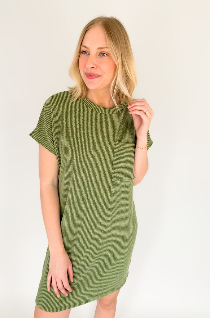 This ribbed shirt dress is a stylish way to stay comfortable. The short sleeves and front pocket make it practical and ideal for everyday wear, while the ribbed fabric gives it a unique and fashionable look. Add to your outfit with our Dee Denim Jacket for a layered look! Show off your style with the Jump on In Ribbed Shirt Dress! 