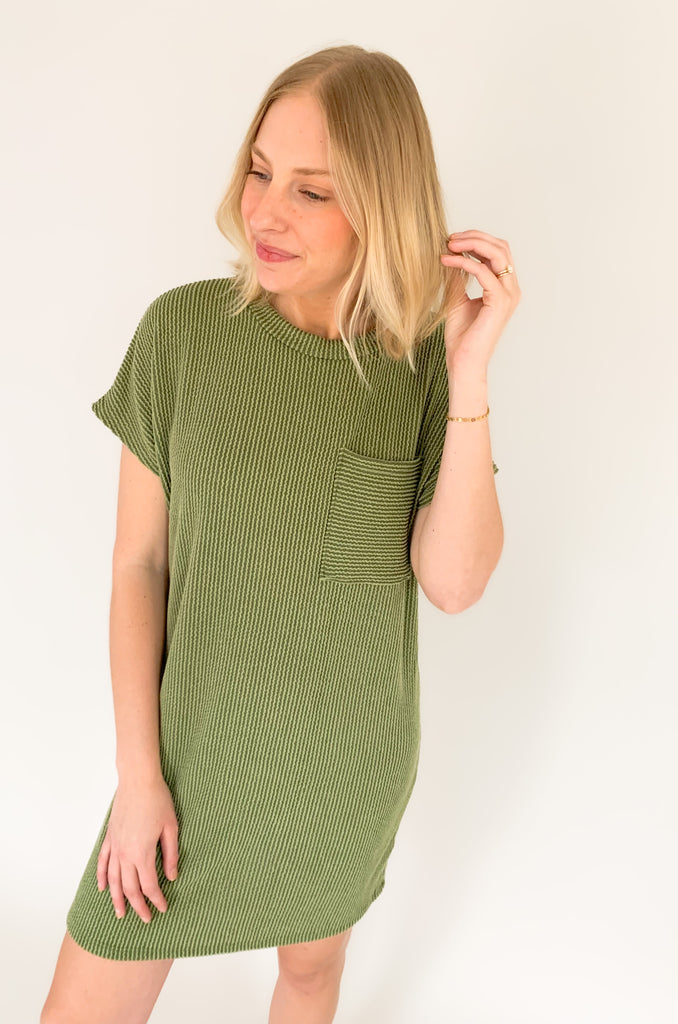 This ribbed shirt dress is a stylish way to stay comfortable. The short sleeves and front pocket make it practical and ideal for everyday wear, while the ribbed fabric gives it a unique and fashionable look. Add to your outfit with our Dee Denim Jacket for a layered look! Show off your style with the Jump on In Ribbed Shirt Dress! 
