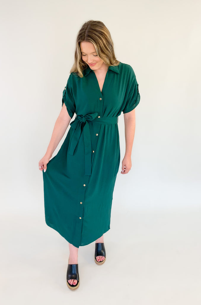 short sleeve long midi dress with gold button details, cuffed sleeves, and a waist belt-available in black and forest green