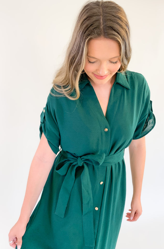 short sleeve long midi dress with gold button details, cuffed sleeves, and a waist belt-available in black and forest green