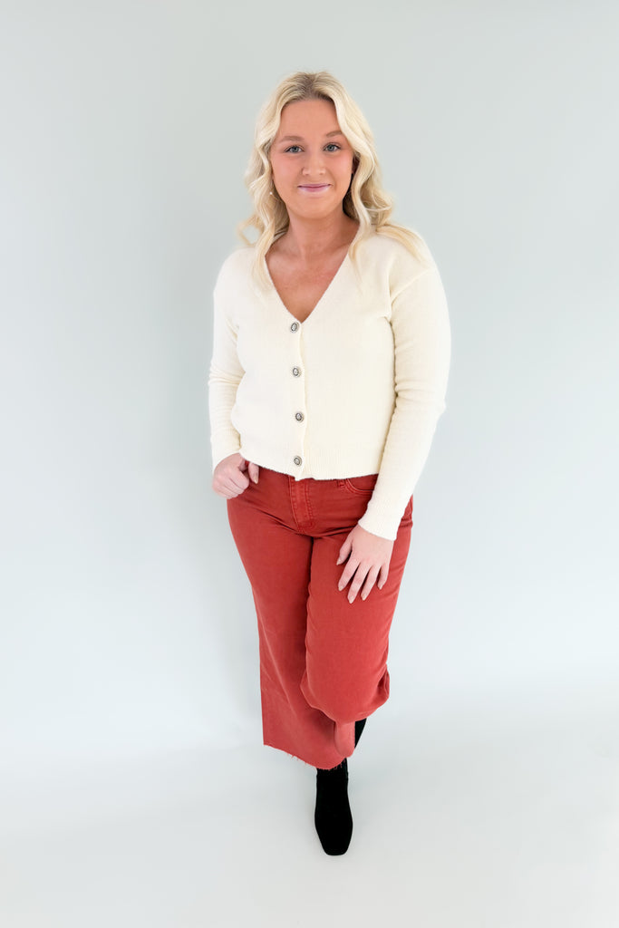 cream  neck soft stretchy cardigan with jewel buttons. perfect holiday cardigan