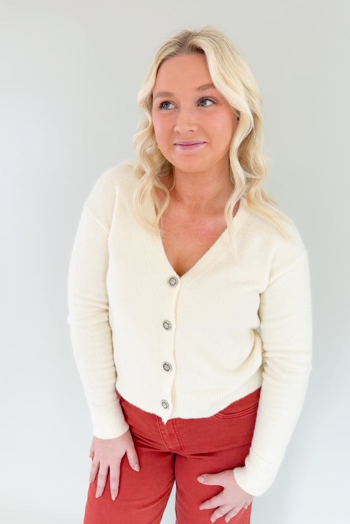 cream  neck soft stretchy cardigan with jewel buttons. perfect holiday cardigan
