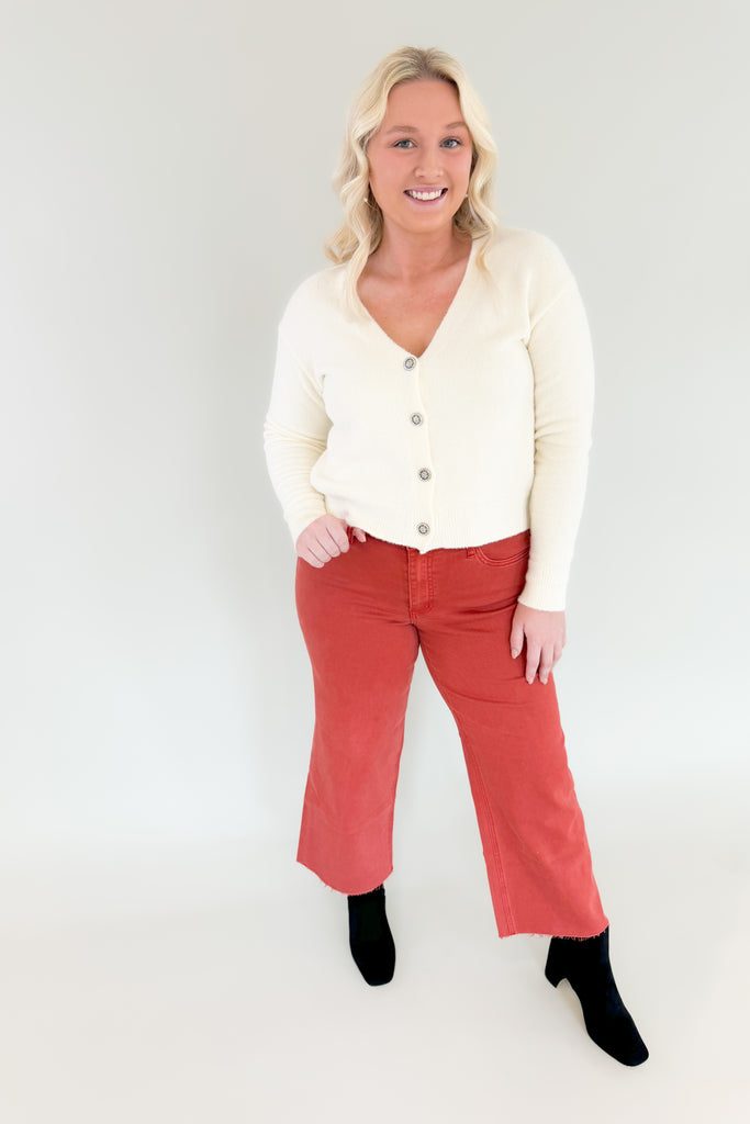 cream  neck soft stretchy cardigan with jewel buttons. perfect holiday cardigan