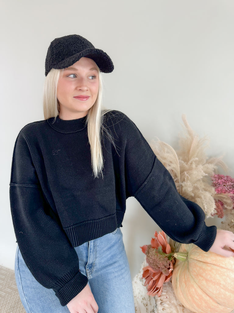 Stay cozy and stylish in this Knit Dolman Wide Sleeve Sweater! Crafted with unique exposed stitch detail and elevated fabric, this semi-cropped sweater is perfect for any occasion. Available in both black and beige, classic colors for all seasons. 