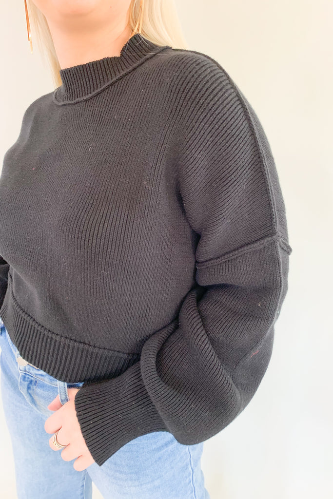Stay cozy and stylish in this Knit Dolman Wide Sleeve Sweater! Crafted with unique exposed stitch detail and elevated fabric, this semi-cropped sweater is perfect for any occasion. Available in both black and beige, classic colors for all seasons. 
