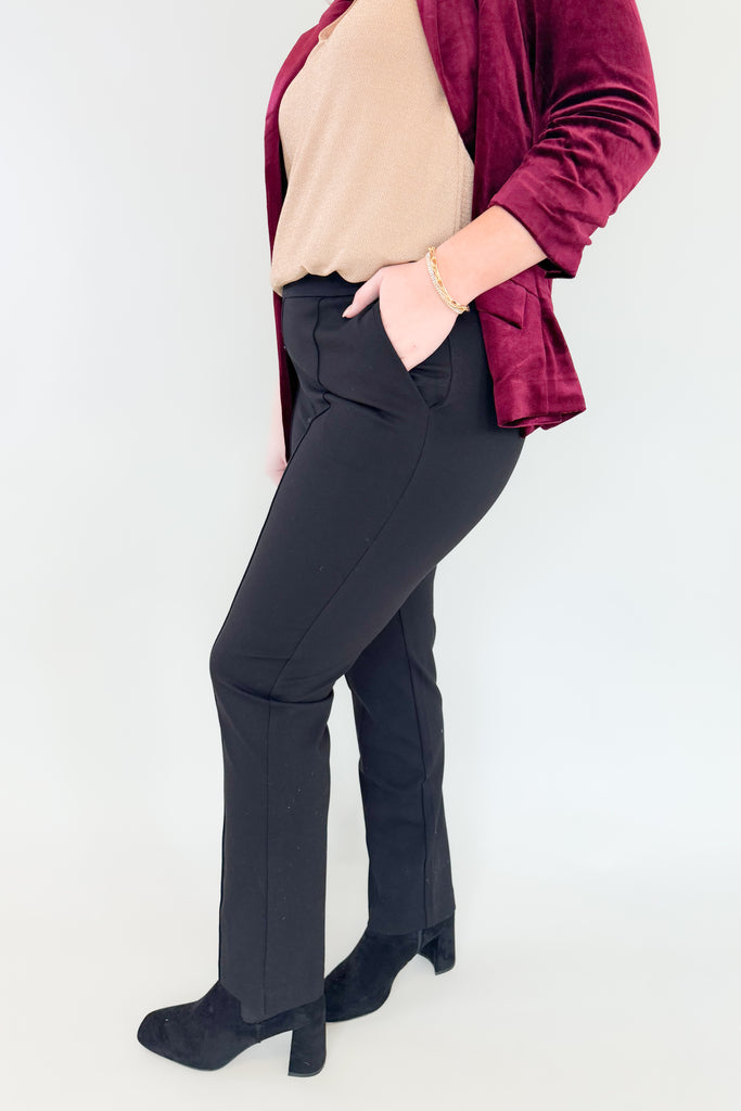 Love a tailored look!? If so you will immediately gravitate towards the Knit Stretch Pintuck Trousers. Available in black and mde with an elastic waist and a tailored fit, these trousers are perfect for your work wardrobe. Enjoy a classic silhouette while still feeling comfortable all day.