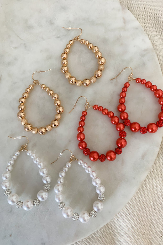 The Large Beaded Teardrop Earrings are perfect for the holiday season, but can surly be worn throughout the year. They are fun with a touch of sparkle! Choose between red, gold, or white to complete your look. 