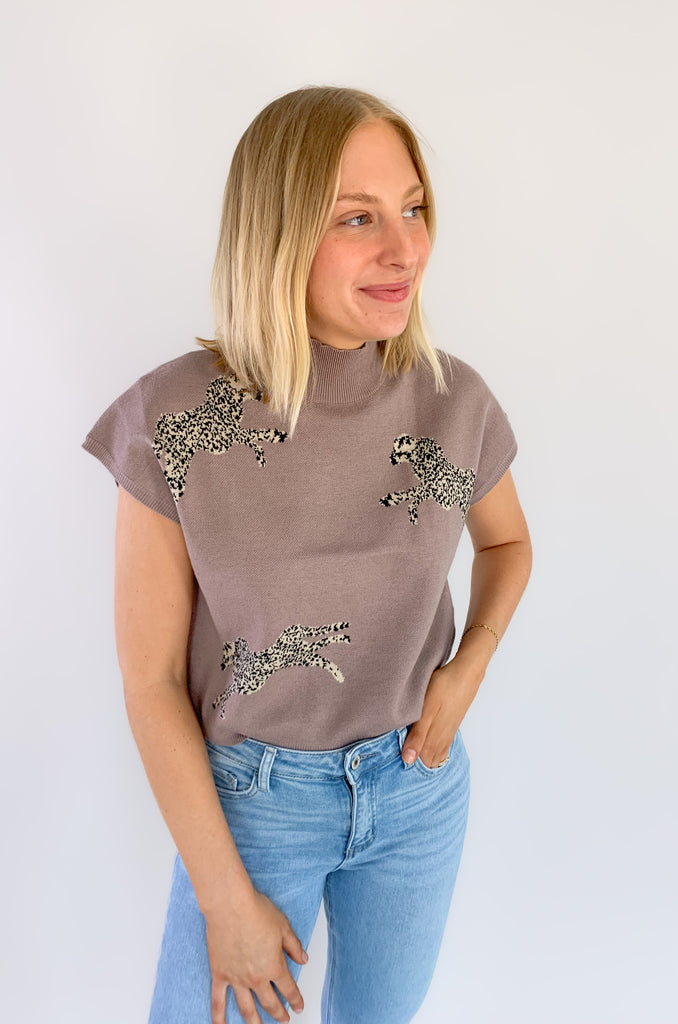Look stylish in the Leopards Walking Mock Neck Cropped Sleeveless Top! This comfortable top features a cropped and sleeveless design with a mock neckline for a sleek, put-together look. Plus, the trendy boxy look, similar to a sweater vest is right on trend. You could eaven layer it over a long sleeve tee in the winter time. 