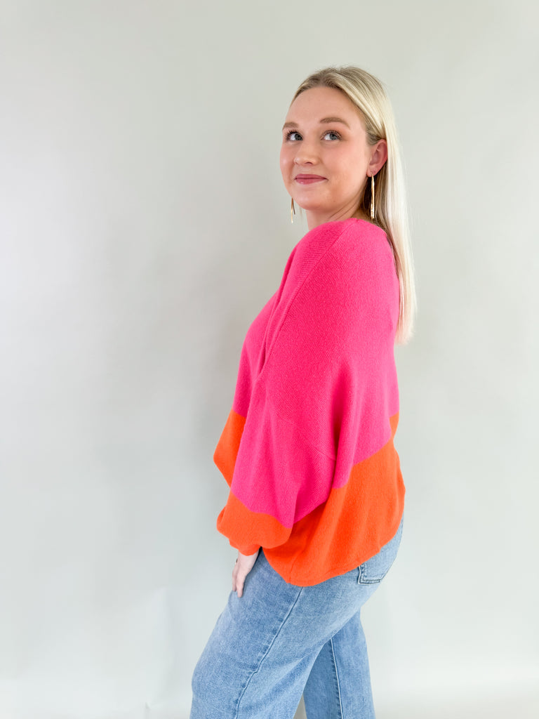 Experience the perfect blend of warmth and style with the Liz Orange + Pink Block Sweater! Featuring hints of yellow and neon orange in a lightweight soft fabric, it's a stunner for any fashion forward wardrobe. Plus the bold color is so on trend, you cannot  go wrong with this one. 