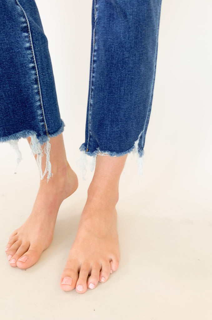Light wash mid rise straight leg jeans with slight distressing around the pockets. 