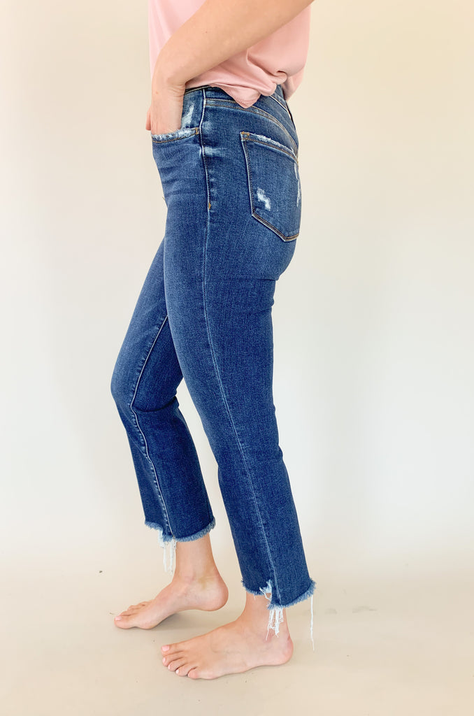 Light wash mid rise straight leg jeans with slight distressing around the pockets. 