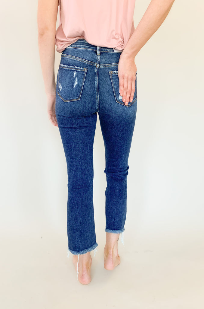 Light wash mid rise straight leg jeans with slight distressing around the pockets. 
