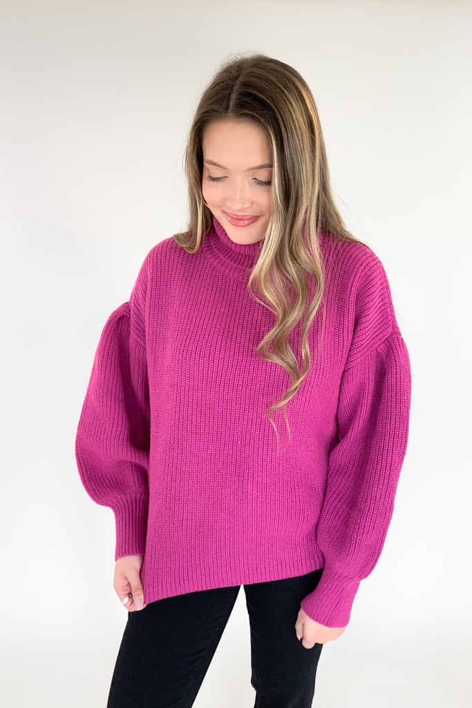 This turtleneck sweater with loose silhouette is perfect for the holiday season! The color is absolutely stunning. Who is not obsessed with magenta right now!? With a bold ballon sleeve silhouette, turtleneck, and luxe knitted fabric, you will be reaching for this amazing sweater all season! 