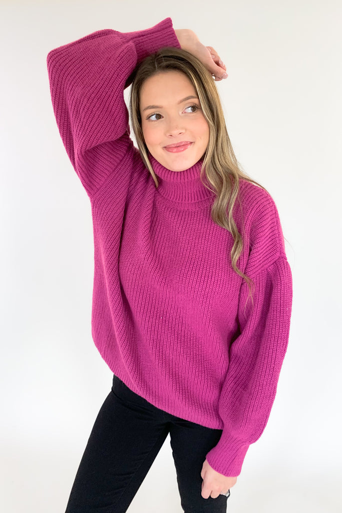 This turtleneck sweater with loose silhouette is perfect for the holiday season! The color is absolutely stunning. Who is not obsessed with magenta right now!? With a bold ballon sleeve silhouette, turtleneck, and luxe knitted fabric, you will be reaching for this amazing sweater all season! 