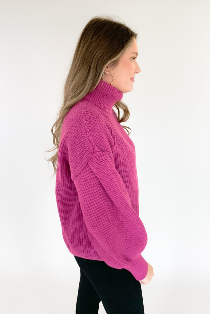 This turtleneck sweater with loose silhouette is perfect for the holiday season! The color is absolutely stunning. Who is not obsessed with magenta right now!? With a bold ballon sleeve silhouette, turtleneck, and luxe knitted fabric, you will be reaching for this amazing sweater all season! 