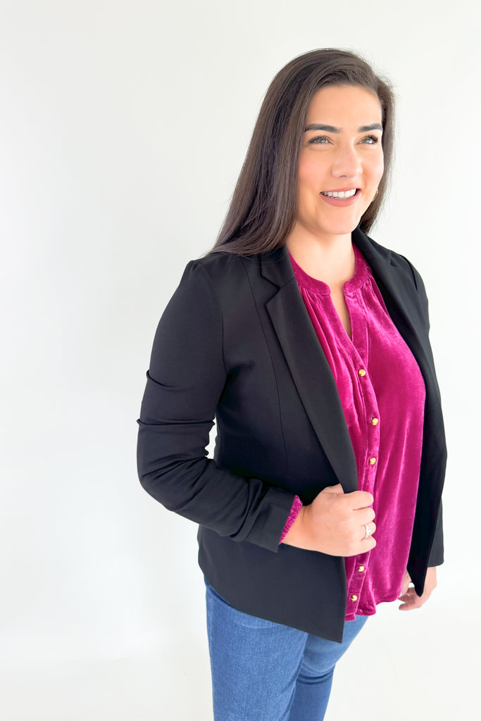 Bring holiday cheer to your wardrobe with this soft, stretchy dark magenta long sleeve velour top! Featuring a flattering silhouette with balloon sleeves, a flowy body, and pretty gold buttons, you will reaching for this stunner time and time again. It's perfect for special occasions and work, while adding a fun and confident touch to any look!