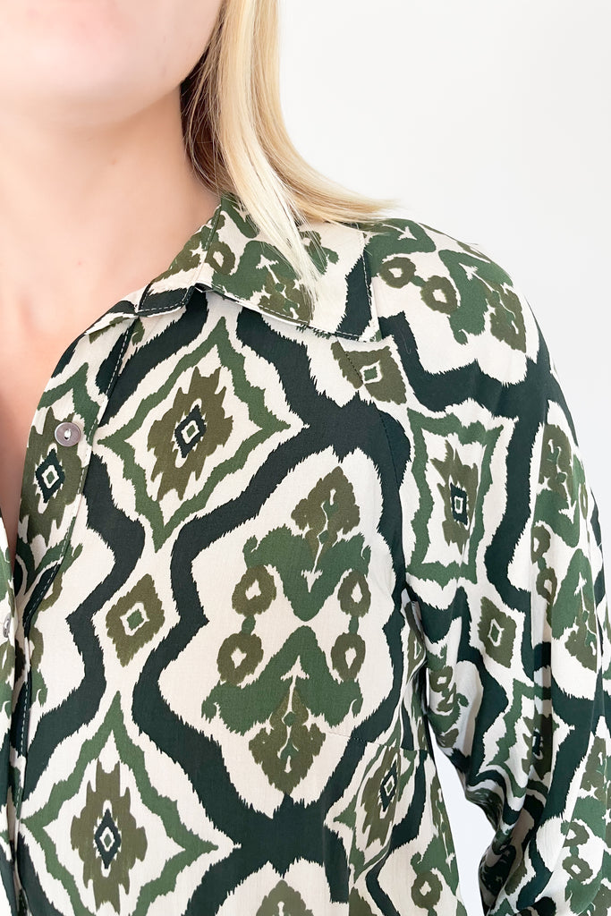 The Macy Olive Printed Midi Dress is the perfect way to elevate your wardrobe! This stylish piece has a button-up top with collared details and long sleeves, plus a tiered body for a flattering shape. It reads very boho chic. 