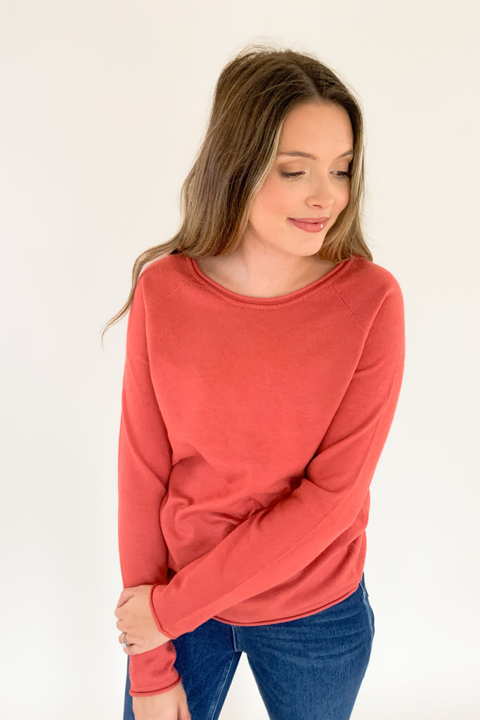 Soft, scoop neck long sleeve sweater available in several colors and Sizes: small-xlarge