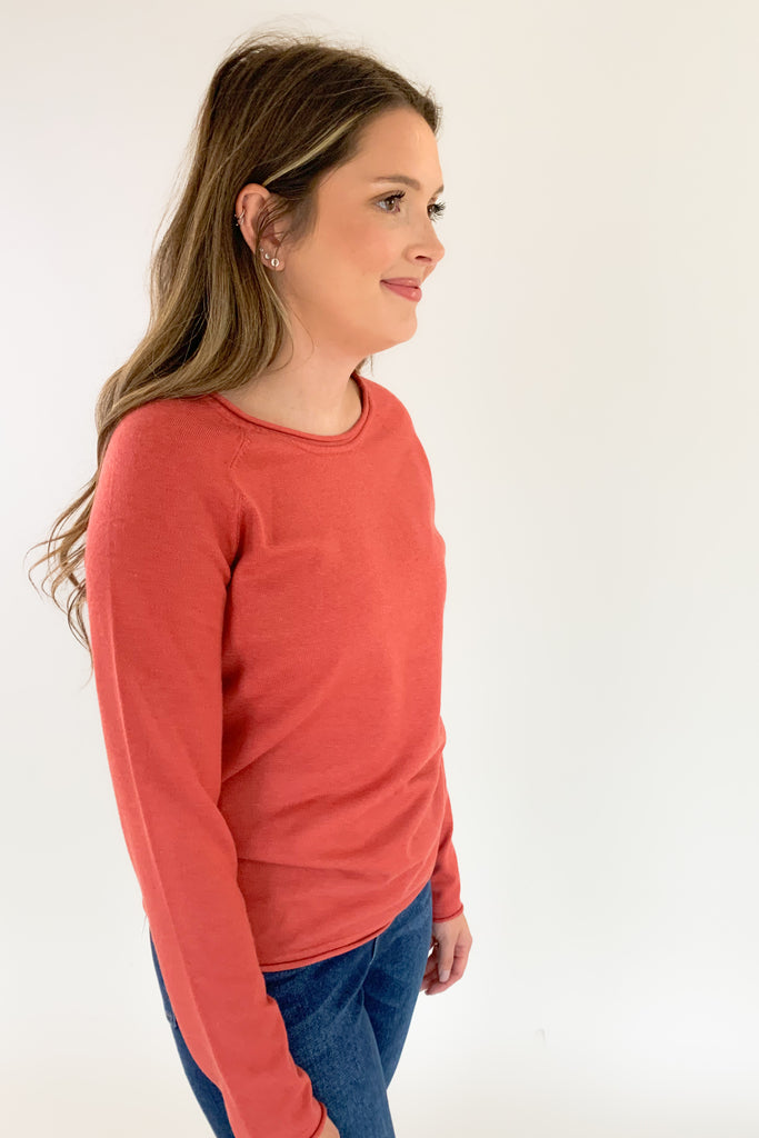 Soft, scoop neck long sleeve sweater available in several colors and Sizes: small-xlarge