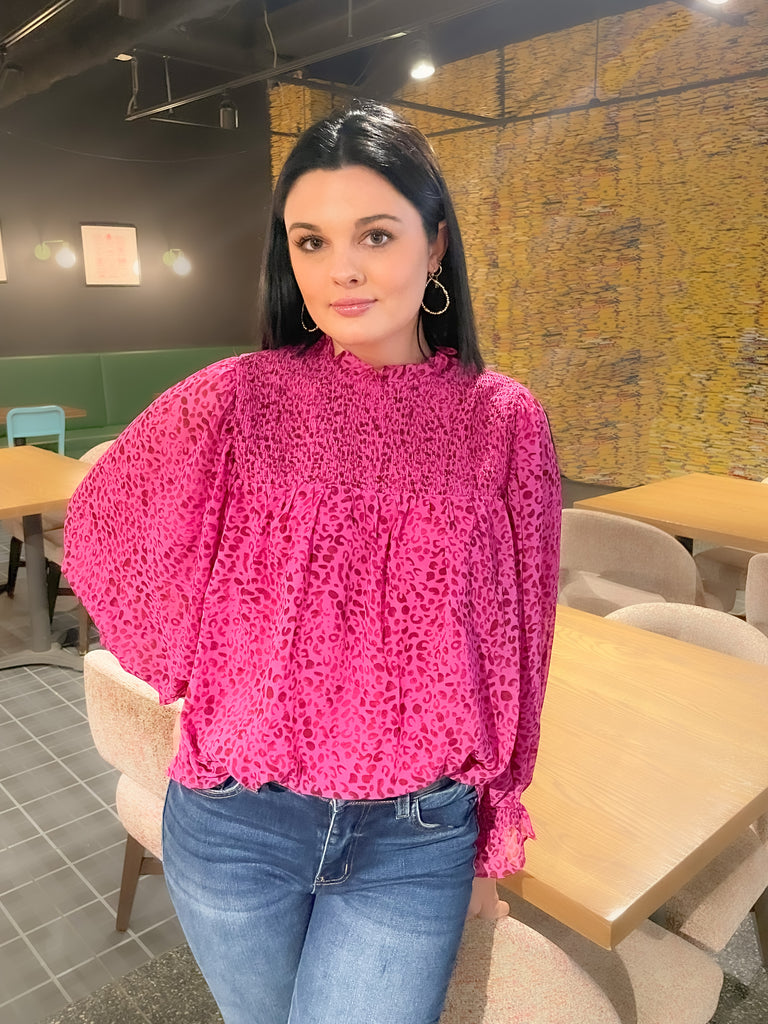 Magenta pink with leopard print blouse with ruched details, flowy body, and balloon sleeves