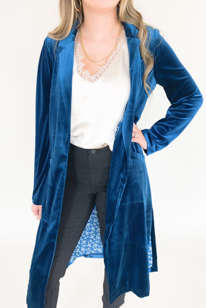 Skies are blue long velvet duster with lapel collar and gorgeous floral satin lining. Available in terracotta, magenta, purple, and teal