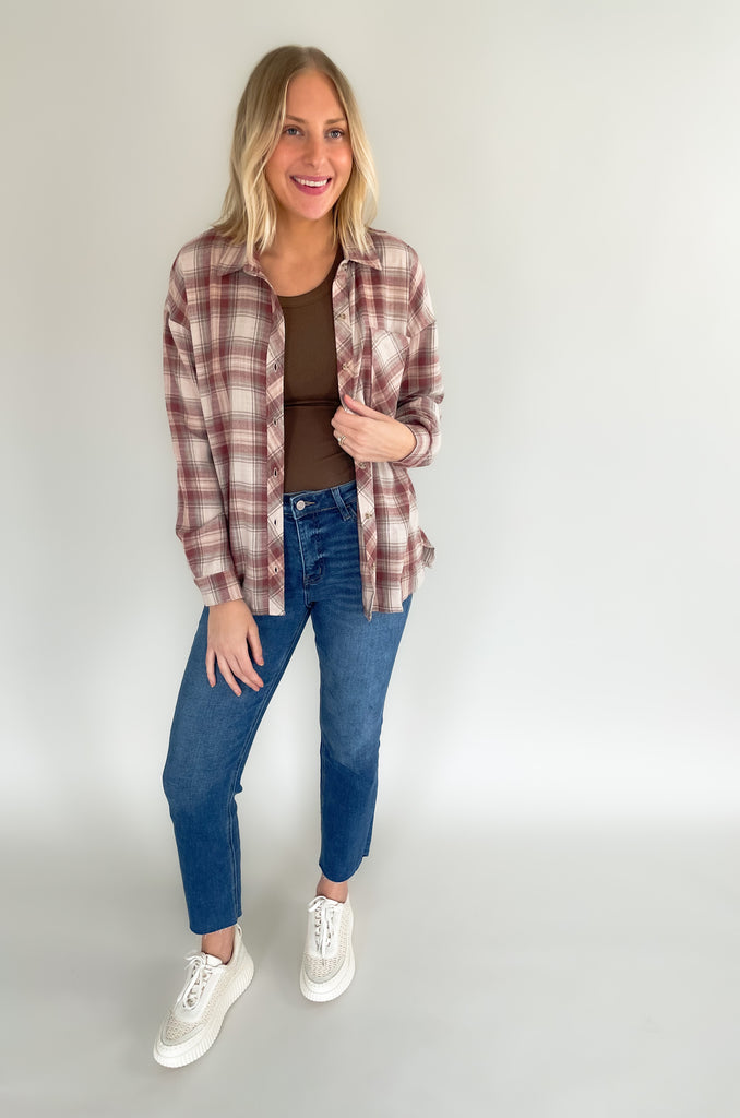 button down single breast pocket flannel with marroon and brown print. Slightly oversized fit