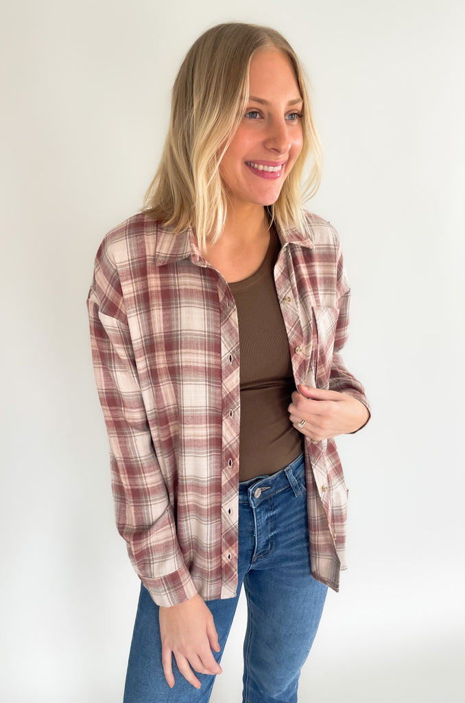 button down single breast pocket flannel with marroon and brown print. Slightly oversized fit