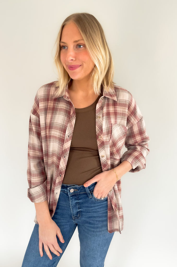 button down single breast pocket flannel with marroon and brown print. Slightly oversized fit