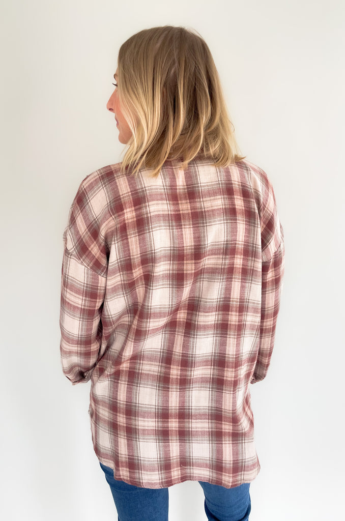 button down single breast pocket flannel with marroon and brown print. Slightly oversized fit
