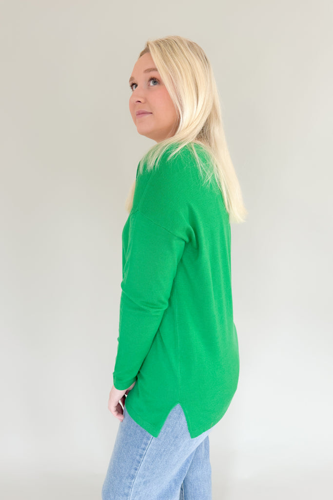 Experience the comfort and style of the Mary's Boatneck Long Sleeve Sweater! Soft, lightweight fabric and side slits for added breathability, you will be reaching for this stunner all season. This winter-ready sweater comes in a fun holiday green or red. 